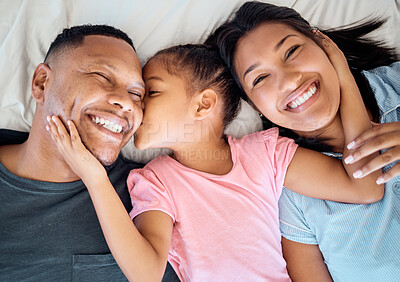 Buy stock photo Top view, kiss and black family with girl on bed, smile and happy for bonding, loving and together. Portrait, love and mother with father, daughter and happiness to connect, in bedroom and embrace