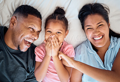Buy stock photo Love, top view and portrait of family in bed laughing, smiling and having fun together. Happiness, weekend and mother with father and girl laying in bedroom bonding, relaxing and enjoying morning