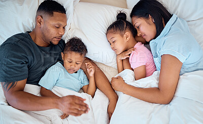 Buy stock photo Family, sleeping and in bed together, love and care with parents and children at family home. Mother, father and kids rest, relax and sleep comfortable in bedroom with cuddle and bonding.
