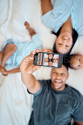 Buy stock photo Black family, happy or phone selfie in bedroom for love, relax or post it on social media app in house. Portrait, family photo or parents and children on bed with smartphone, tech or screen top view