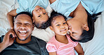 Happy family, love and relax in bed together for support, care and quality time bonding. Parents, children and mom kiss girl face for affection, happiness and beautiful portrait in family home