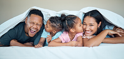 Buy stock photo Black family, bed together and happy under blanket in home with love, care and bonding with kiss on cheek. Black woman, man and kids in bedroom in house for happy family moment, time or relax in home