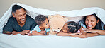Black family, bed and teddy bear with parents and kids kissing a stuffed animal while lying together in a bedroom. Portrait, love and children inside to relax in the morning with mother and father