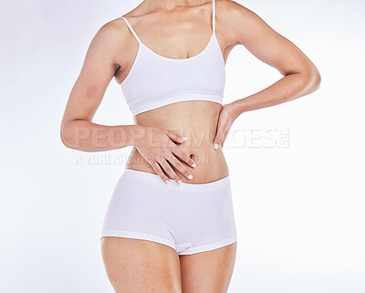 Buy stock photo Body, health and fitness with stomach and wellness, body care motivation against white studio background. Slim, exercise and skincare, model in underwear, healthy skin and diet mockup with treatment.
