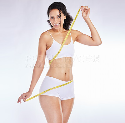 Weight loss, measure tape and wellness of a black woman beauty model with  stomach measurement. Portrait of a woman checking health, diet and healthy  fitness progress feeling happy with a smile