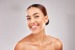 Skincare, wellness and portrait of latin woman with smile on gray background in studio. Beauty, dermatology and confident young female model for healthy skin, makeup and cosmetic beauty products