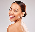 Skincare, beauty and woman with a smile while marketing cosmetics against a white studio background. Spa, wellness and face of a girl model advertising natural skin for dermatology and self care