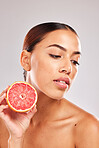 Beauty, skincare and grapefruit cosmetics product for natural skin wellness, citrus and vitamin c detox. Facial spa treatment, organic healthcare and black woman face for a studio advertising mockup 