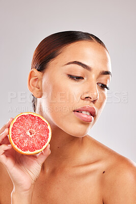 Buy stock photo Beauty, skincare and grapefruit cosmetics product for natural skin wellness, citrus and vitamin c detox. Facial spa treatment, organic healthcare and black woman face for a studio advertising mockup 
