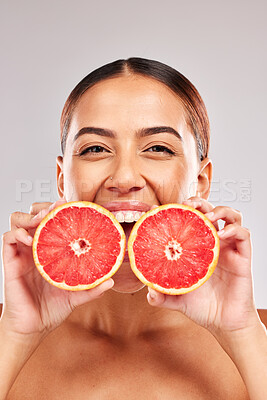 Buy stock photo Skincare, beauty and portrait of woman with grapefruit in hands on white background in studio. Wellness, body care and female with fruit for organic, natural and healthy cosmetics and makeup products