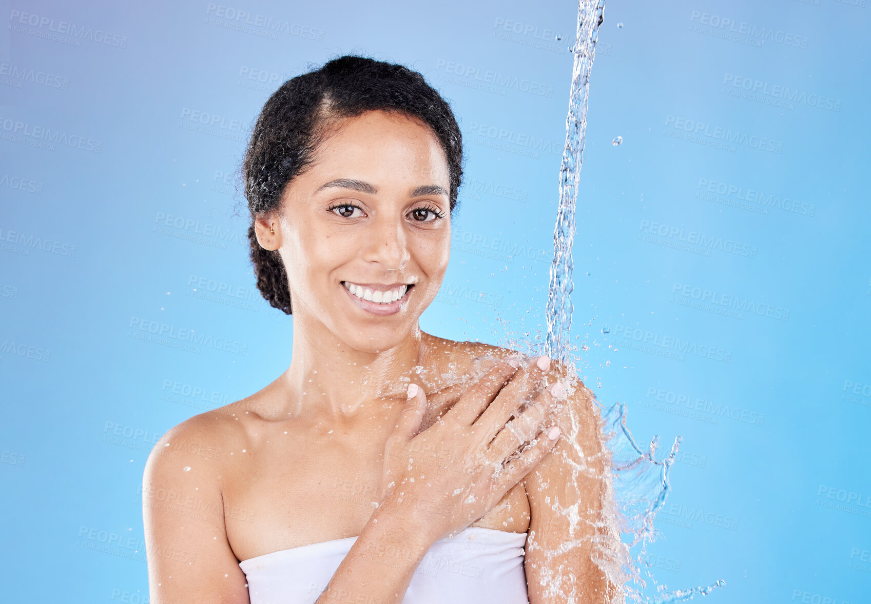 Buy stock photo Shower, black woman and water splash, skincare and happy portrait of wellness, hygiene or health on blue studio background. Cleaning, cleansing and bathroom with a attractive young female in bathroom