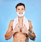 Shave, grooming and hygiene with a man model in studio on a blue background for body or skincare. Portrait, hair removal and beauty with a handsome young male posing to promote hygienic shaving