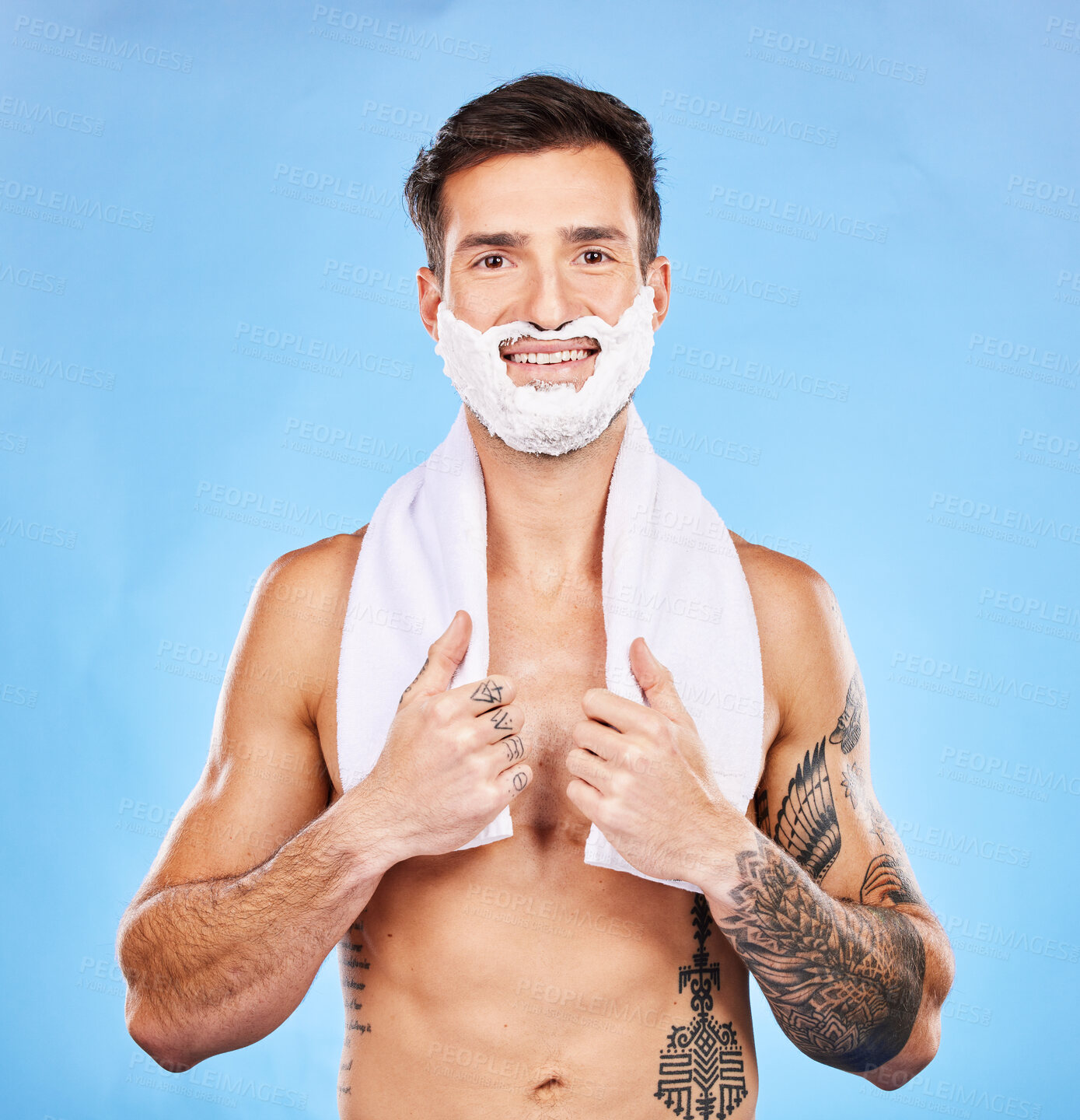 Buy stock photo Shave, grooming and hygiene with a man model in studio on a blue background for body or skincare. Portrait, hair removal and beauty with a handsome young male posing to promote hygienic shaving