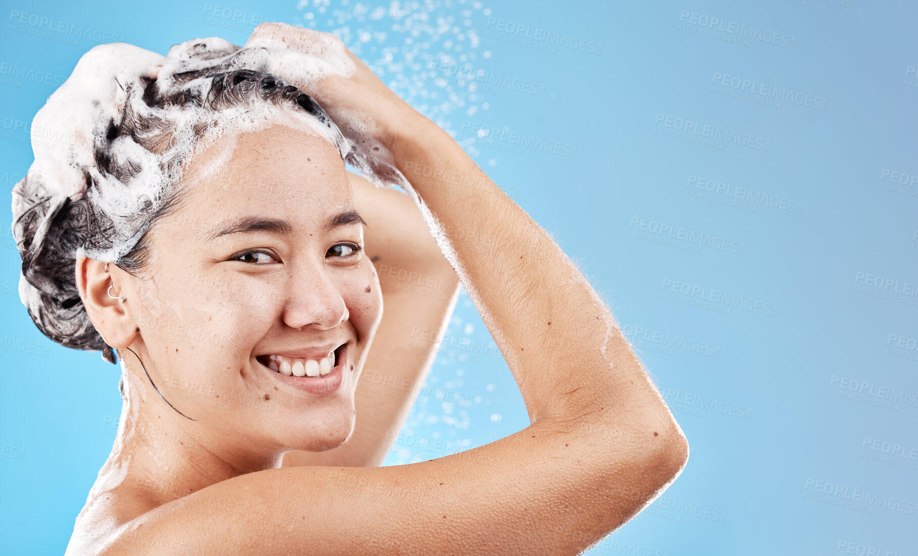 Buy stock photo Water, shampoo and woman in shower on blue background, haircare and hygiene routine in the morning. Model in shower cleaning hair, soap and foam with running water for clean fresh beauty with mockup