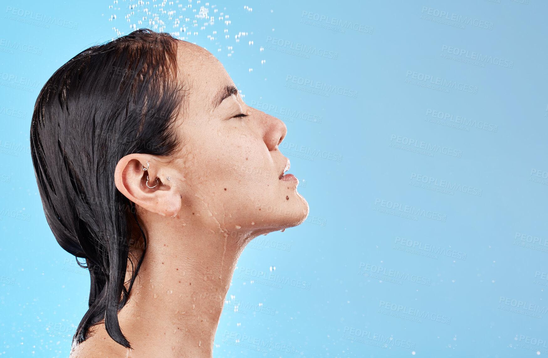 Buy stock photo Heath, hair and woman in shower on blue background with mockup, advertising or product placement space. Haircare, water and skincare, hygiene routine in the morning asian woman with clean lifestyle.