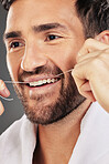 Man, teeth and face smile for dental floss, skincare or cosmetics for fresh clean or healthy hygiene. Closeup of bearded male flossing toothy mouth for oral, dermatology or gum care treatment