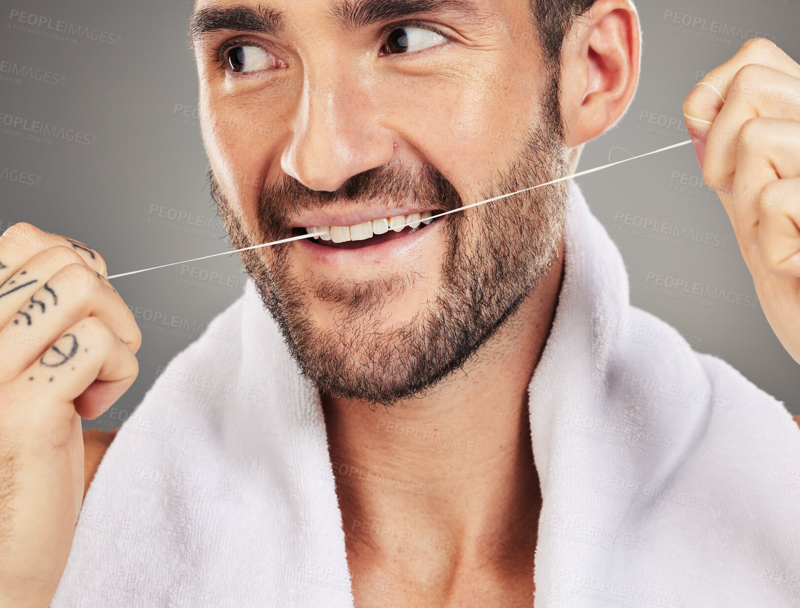 Buy stock photo Man, floss and teeth. dental health and hygiene for mouth wellness, advertising and cleaning product against a grey studio background. Male model, clean and tooth healthcare, healthy and flossing