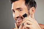 Face, skincare and man shaving with razor in studio isolated on gray background mockup. Smile, wellness and happy male model from Australia shave beard or facial hair for grooming, beauty or hygiene