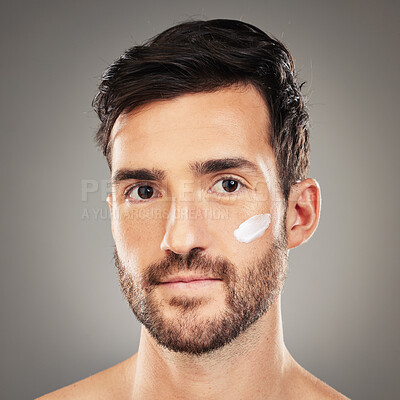 Buy stock photo Cream, man and skincare for natural beauty, wellness and body care with grey studio background. Portrait, cosmetics and healthy male with lotion for hygiene, smooth face and organic facial for health