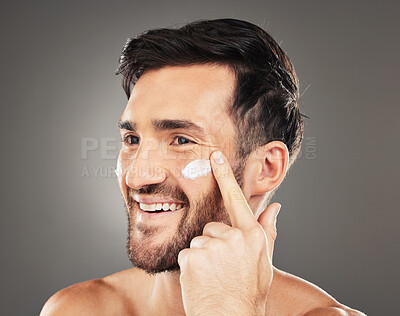 Buy stock photo Beauty, sunscreen and face of man with cream product for health, moisturizing and skin hydration. Happy, healthy and skincare lifestyle routine of model on dark gray studio background.