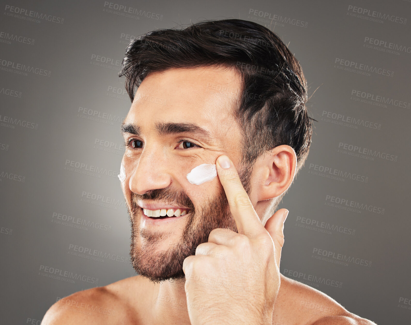 Buy stock photo Beauty, sunscreen and face of man with cream product for health, moisturizing and skin hydration. Happy, healthy and skincare lifestyle routine of model on dark gray studio background.