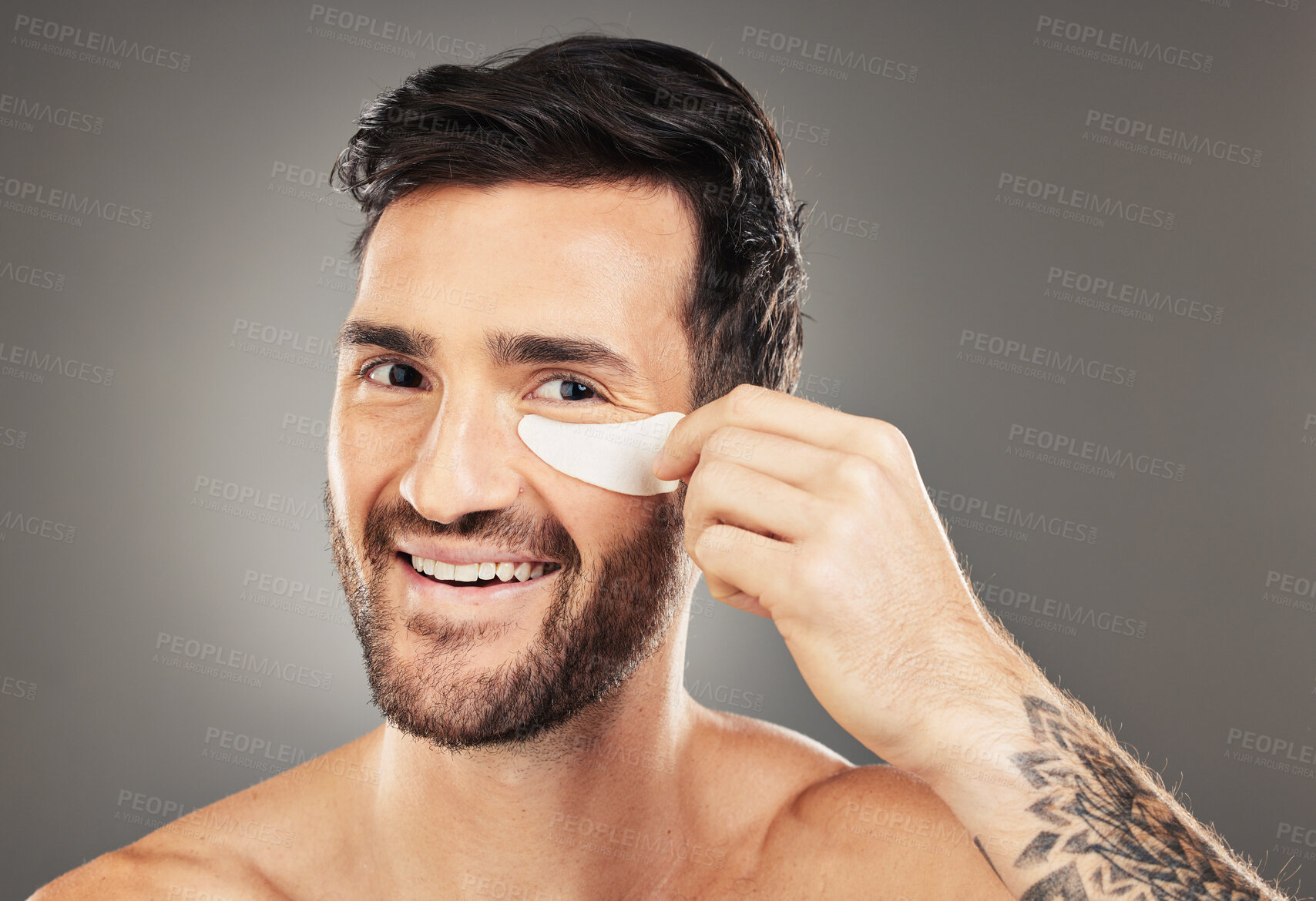 Buy stock photo Man, eye patch and product for skincare, beauty and health with a smile for cosmetic, collagen and dermatology. Male, happy and face portrait with young model advertising healthy skin and wellness