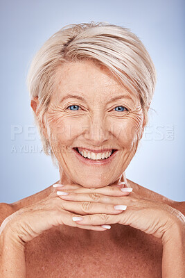 Buy stock photo Skincare, wellness and portrait of senior woman with smile on blue background in studio. Beauty, makeup and face of old woman with natural skin pose for dermatology, body care and antiaging cosmetics