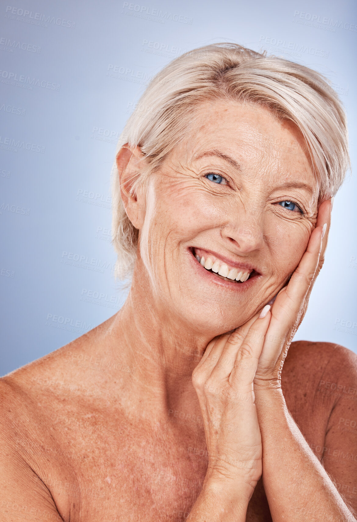 Buy stock photo Senior woman, skincare and happy with cosmetics, health and wellness of face beauty against a grey studio background with mockup. Elderly model, portrait and skin makeup, cosmetic and healthy smile