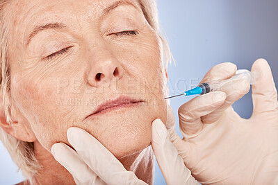 Botox, cosmetics and senior woman with a beautician doing an anti aging treatment in a studio. Beauty, skincare and elderly lady doing cosmetic filler injection for facial wrinkles by gray background