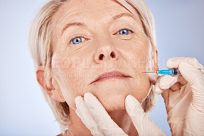 Buy stock photo Botox, senior woman and injection for health, smooth skin and wellness with grey studio background. Plastic surgery, mature female or elderly lady with fine needle, body care facial detox or skincare