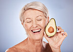 Beauty, skincare and elderly woman with avocado cosmetics smile for organic skin health, natural detox and luxury spa mockup. Portrait of happy senior, wellness treatment and healthy diet in a studio