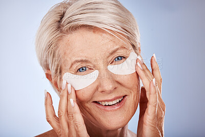 Buy stock photo Senior woman with collagen eyes mask for skincare, dermatology and facial wellness on studio mockup marketing or advertising space. Elderly model portrait and eye patches product for antiaging beauty