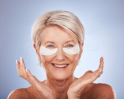 Buy stock photo Skincare, senior woman and eye patches for cosmetic, wellness and natural face routine in studio. Cosmetics, beauty and portrait of elderly lady with anti aging treatment isolated by gray background.