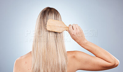 Buy stock photo Hair care, beauty brush and back of woman in studio isolated on gray background. Hair style, grooming and female model brushing hair for healthy morning routine, wellness and cosmetics hair treatment