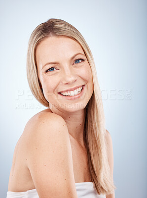 Buy stock photo Hair care, beauty and portrait of a happy woman in a studio for wellness, long and healthy hair. Cosmetic, health and girl model from Australia with a blond hair style isolated by a gray background.