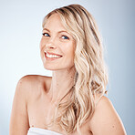 Hair care, cosmetics and portrait of a woman with healthy, happy and blonde hair on a grey studio background. Salon, smile and face of a young model with beauty, shine and clean hair from hairdresser