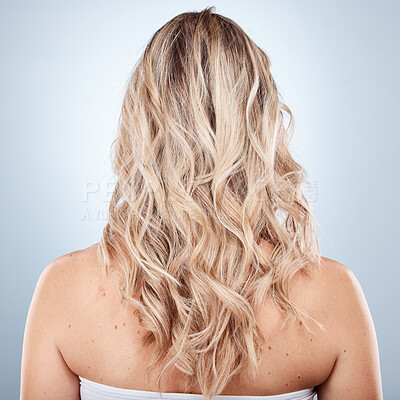 Hair care, beauty and back of woman in studio on a gray background.  Balayage, hairstyle and female model with long, blonde and healthy hair  after salon or cosmetics hair treatment for hair