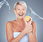 Face, lemon and skincare senior woman in studio portrait with water splash mockup for facial, antiaging glow and healthy food cosmetics. Elderly model, vitamin c lime fruit and dermatology skin care