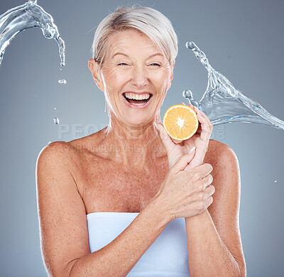 Buy stock photo Face, lemon and skincare senior woman in studio portrait with water splash mockup for facial, antiaging glow and healthy food cosmetics. Elderly model, vitamin c lime fruit and dermatology skin care