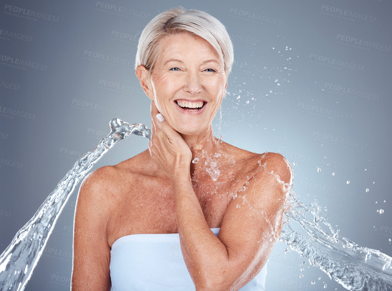 Buy stock photo Mature woman, water and splash for hygiene, shower and cleaning for bodycare and cleansing. Hydration, wash and senior female for beauty, wellness and liquid grooming or skincare and body care