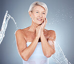 Skincare, water splash and portrait of senior woman in studio for wellness, healthy skin and hydration. Beauty, spa and old woman with water stream for cleansing, facial and moisturizing products