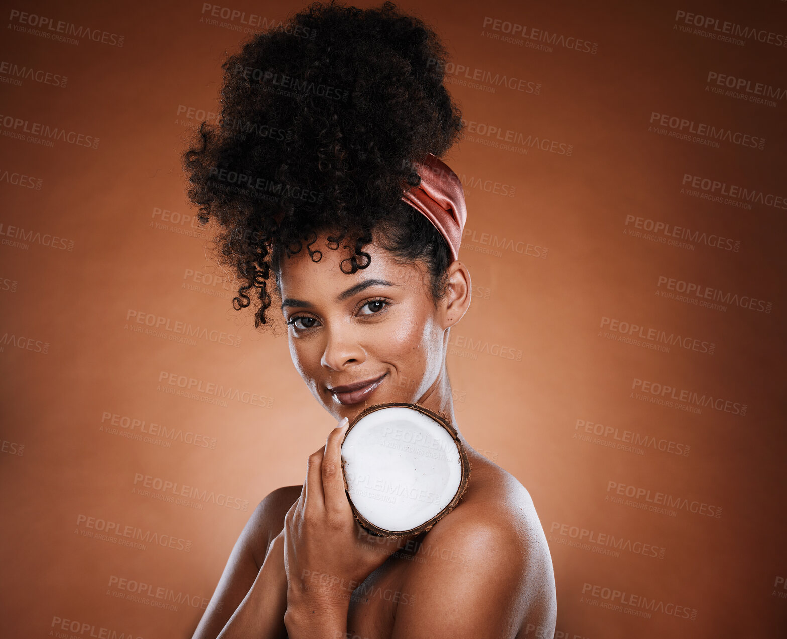 Buy stock photo Woman, coconut fruit and body skincare glow on studio background for organic hydration, vegan moisture or holistic dermatology. Portrait, smile and happy african beauty model with coco butter product