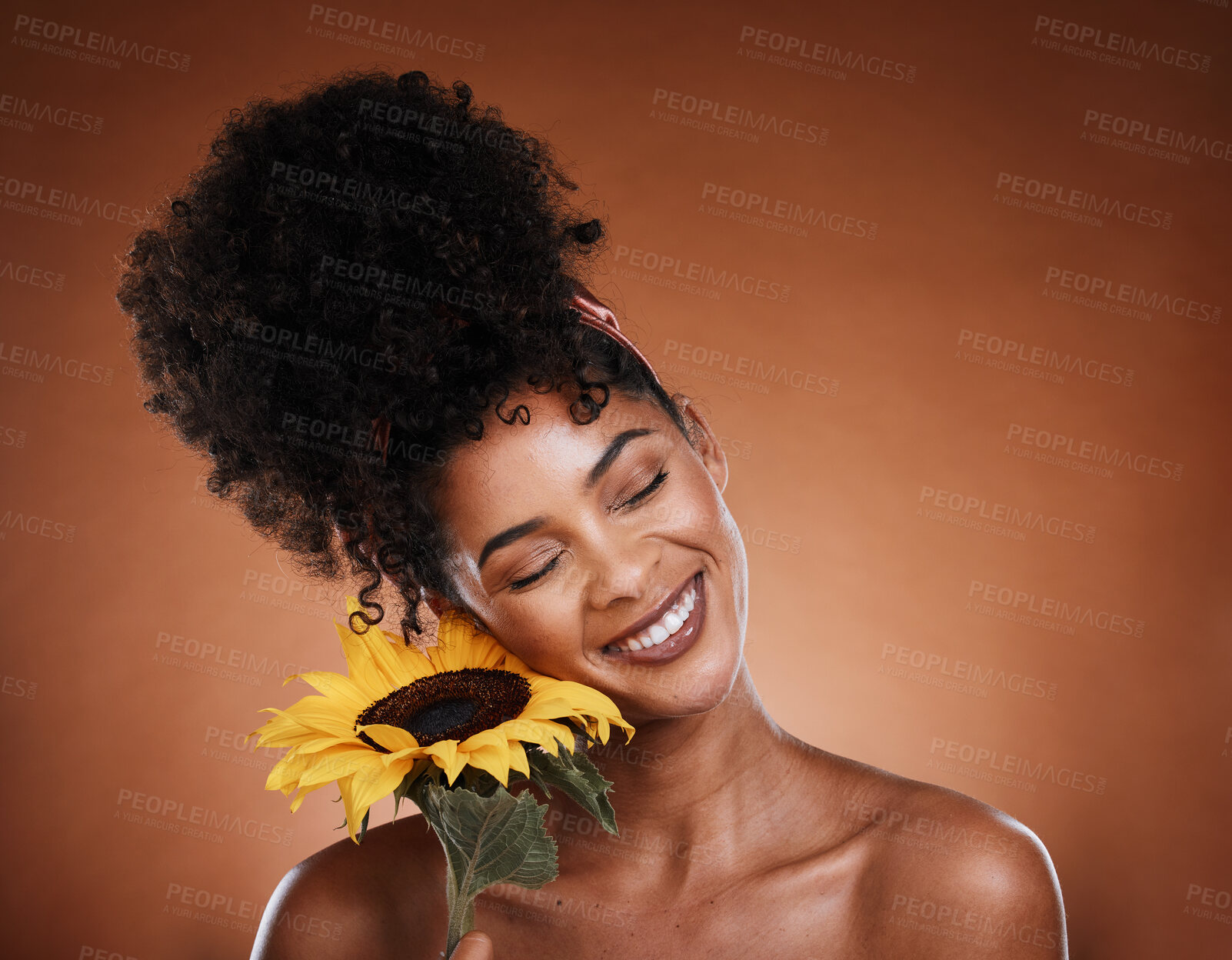 Buy stock photo Sunflower, beauty and black woman in studio for skincare glow, wellness and cosmetics benefits with promotion, marketing and advertising space. Young model with natural flower for hair and skin care