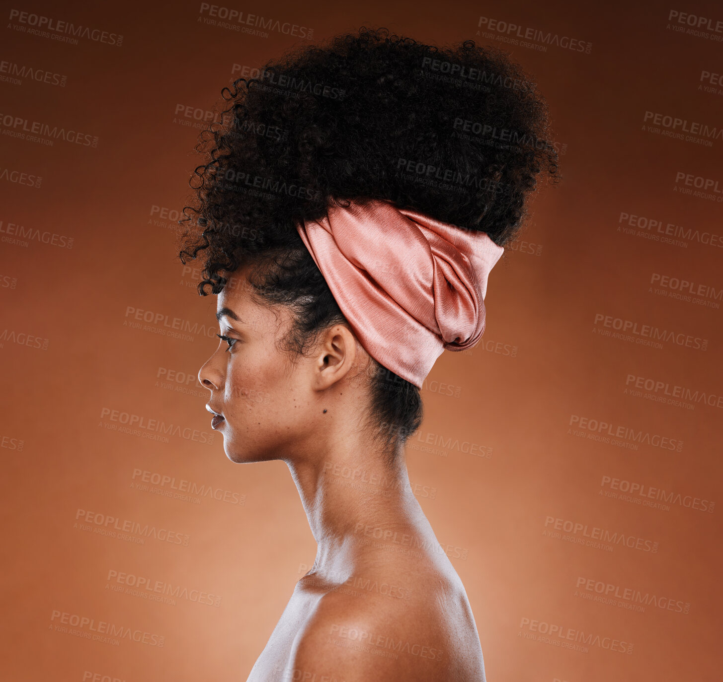 Buy stock photo Black woman, profile and hair care beauty with a scarf, makeup and natural afro against a brown studio background. Fashion, cosmetics and skin wellness, health. and facial cosmetic, female and model