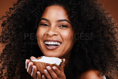 Buy stock photo Face, coconut skincare and portrait of black woman in studio isolated on a brown background. Makeup, organic cosmetics and female model holding fruit for antioxidants, coconut oil and healthy skin.