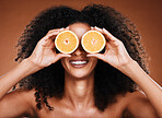 Beauty, skincare and black woman with orange product for cosmetics healthcare, organic and vitamin c treatment. Fruit for skin health, healthy diet and nutrition lifestyle model on studio background 