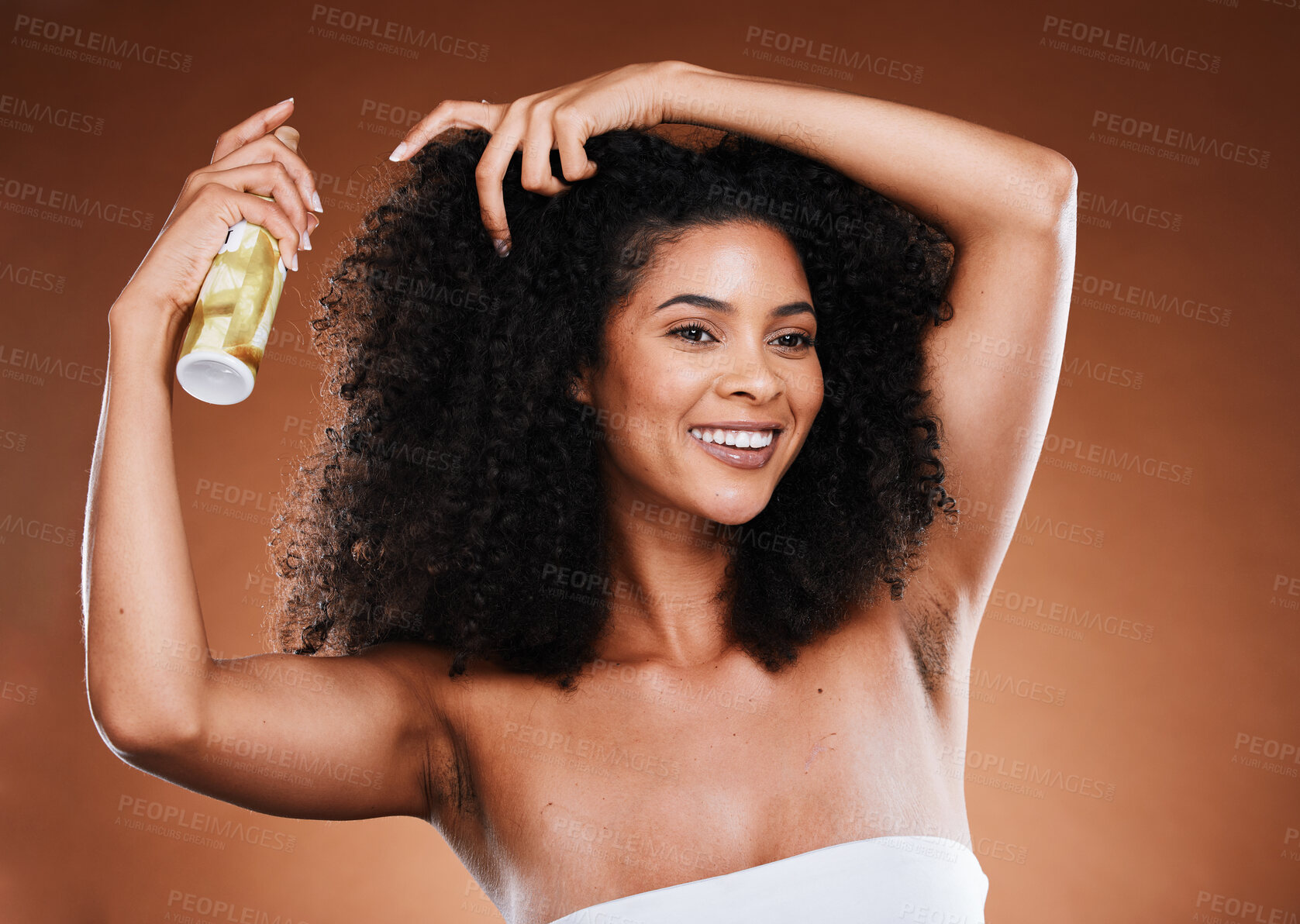 Buy stock photo Hair care, beauty and black woman with hair spray on afro for health, wellness and shine for natural curly hair . Cosmetics, hair salon and female model with hair products on brown background studio