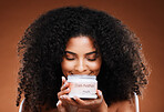 Beauty, hair care and black woman with product jar, organic luxury hair mask moisturizer for afro hairstyle. Health, wellness and portrait of woman marketing haircare treatment in studio background.