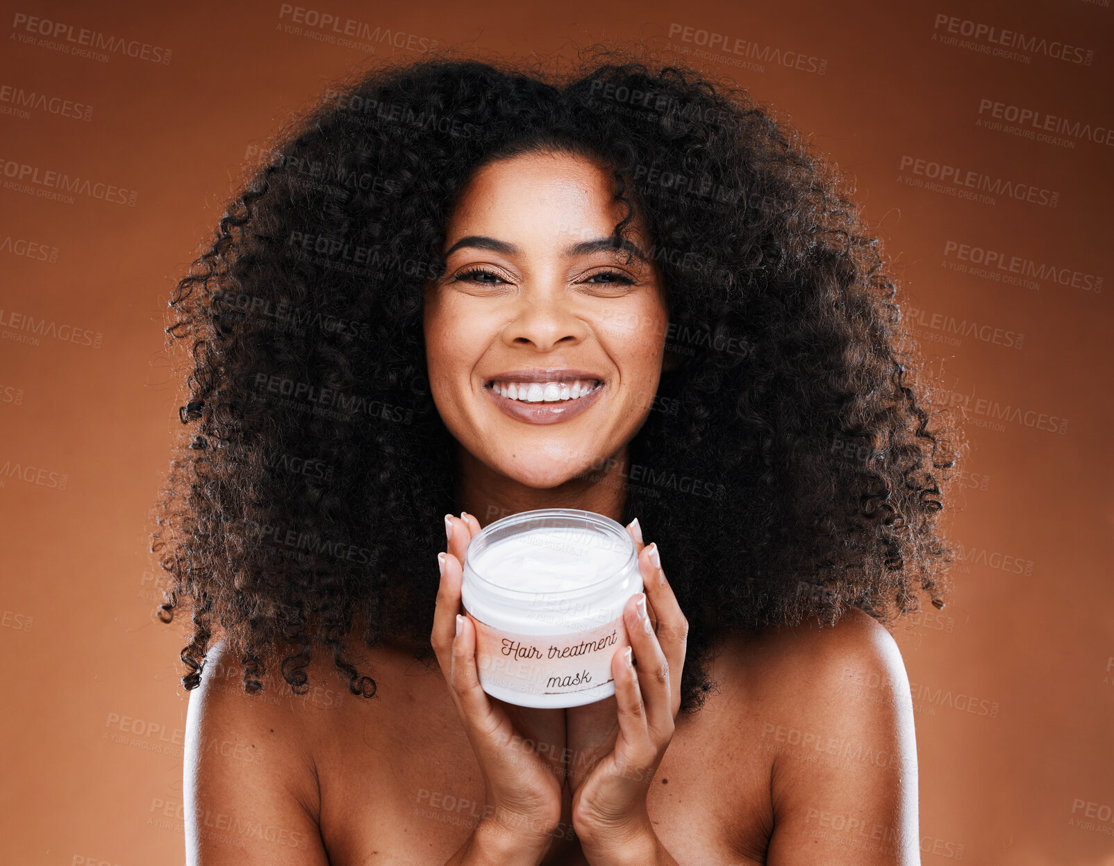 Buy stock photo Cosmetics, cream and black woman with hair, face mask or natural beauty with brown studio background. African American female, confident girl and hair care for healthy scalp, smile and curly afro.