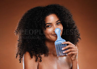 Curly hair comb, beauty and black woman with afro hairstyle, cosmetics and  perm on studio background. Portrait happy young african girl, hair brush  and natural hair care, fashion and funky hair style |